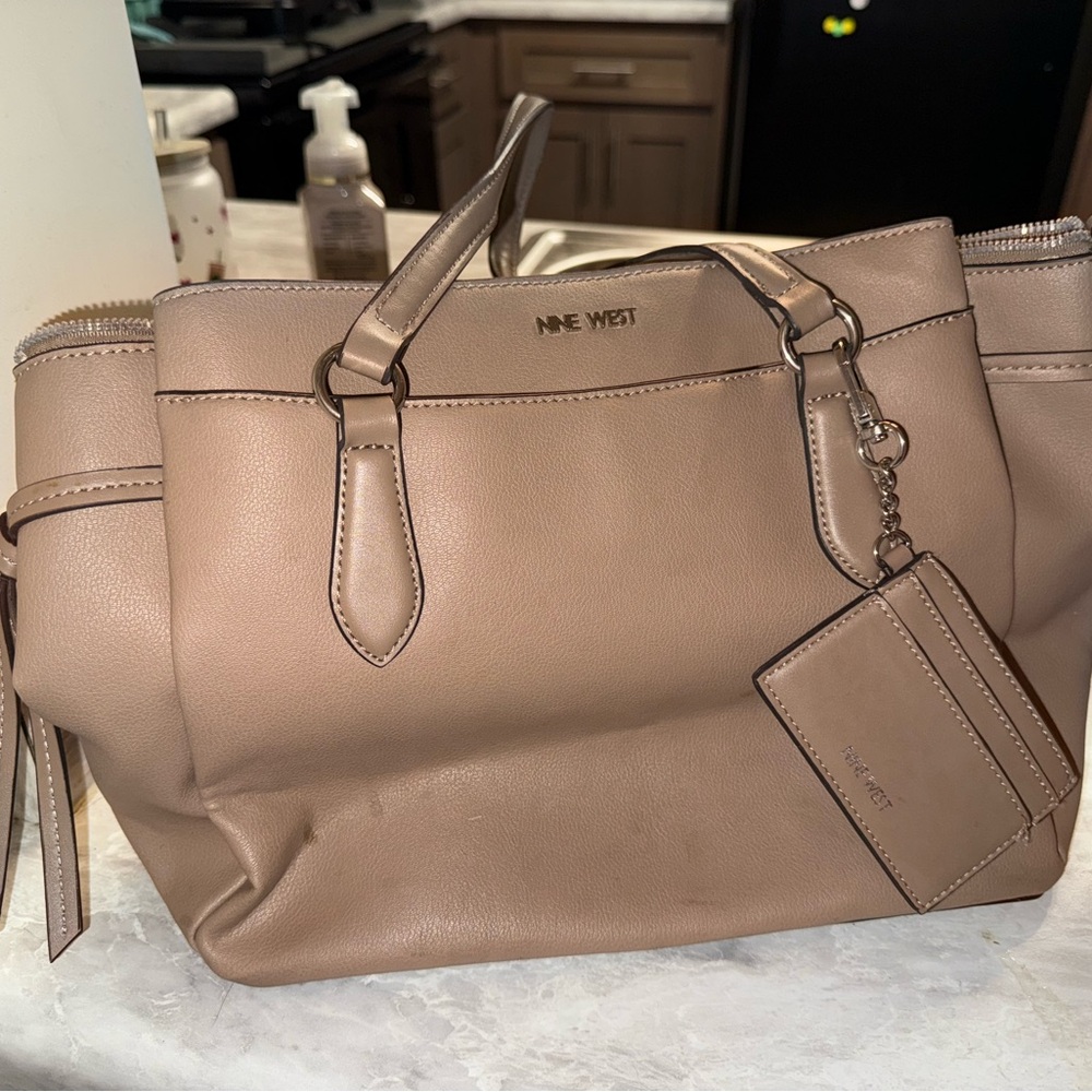 Nine West Tan Tote with Elegant Tassels and Spacious Design